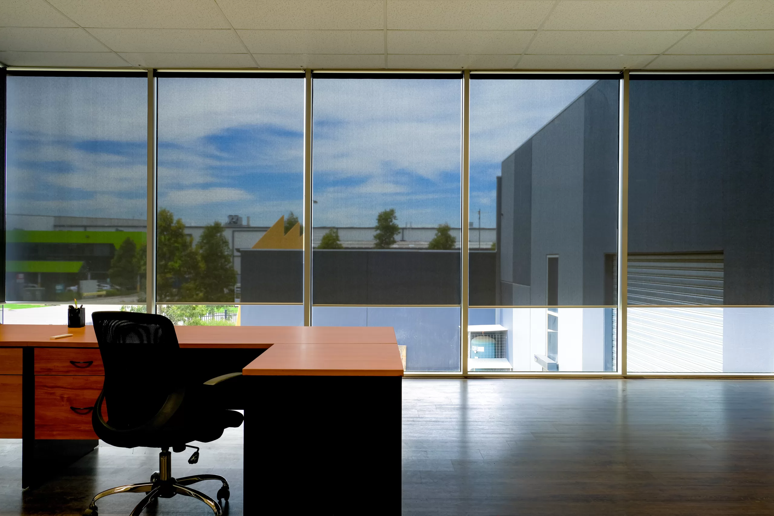 Automated roller blinds in modern office